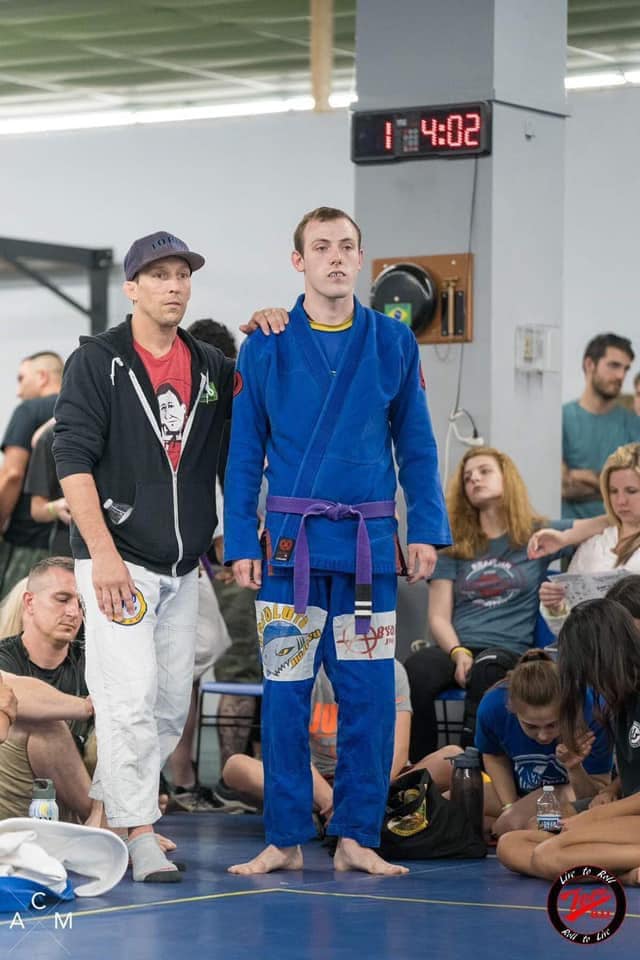 High-level Brazilian Jiu-Jitsu athlete at tournament.