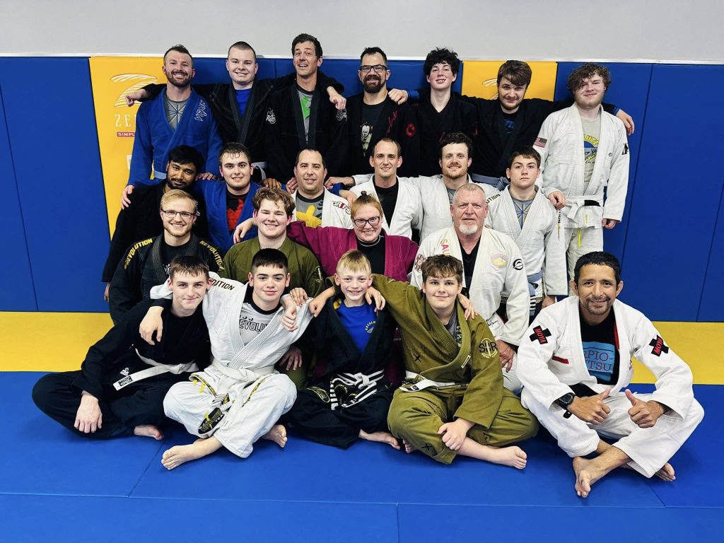 Group of Brazilian Jiu-Jitsu students and instructors at Absolute Jiu-Jitsu Academy in gi.