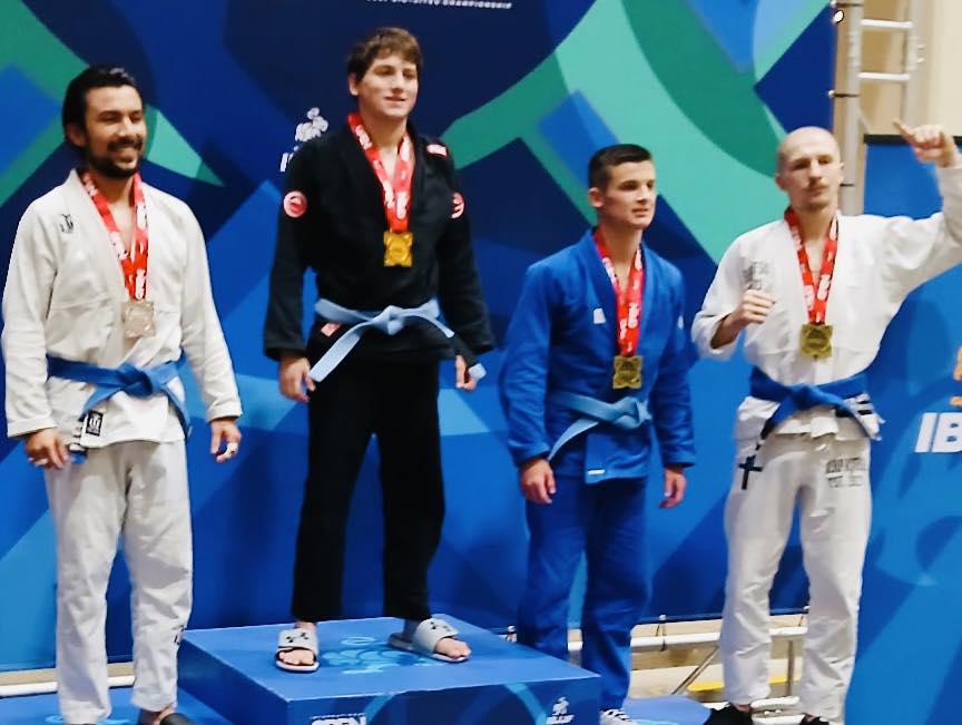 Young athletes celebrate jiu-jitsu victories at Absolute Jiu-Jitsu Academy.