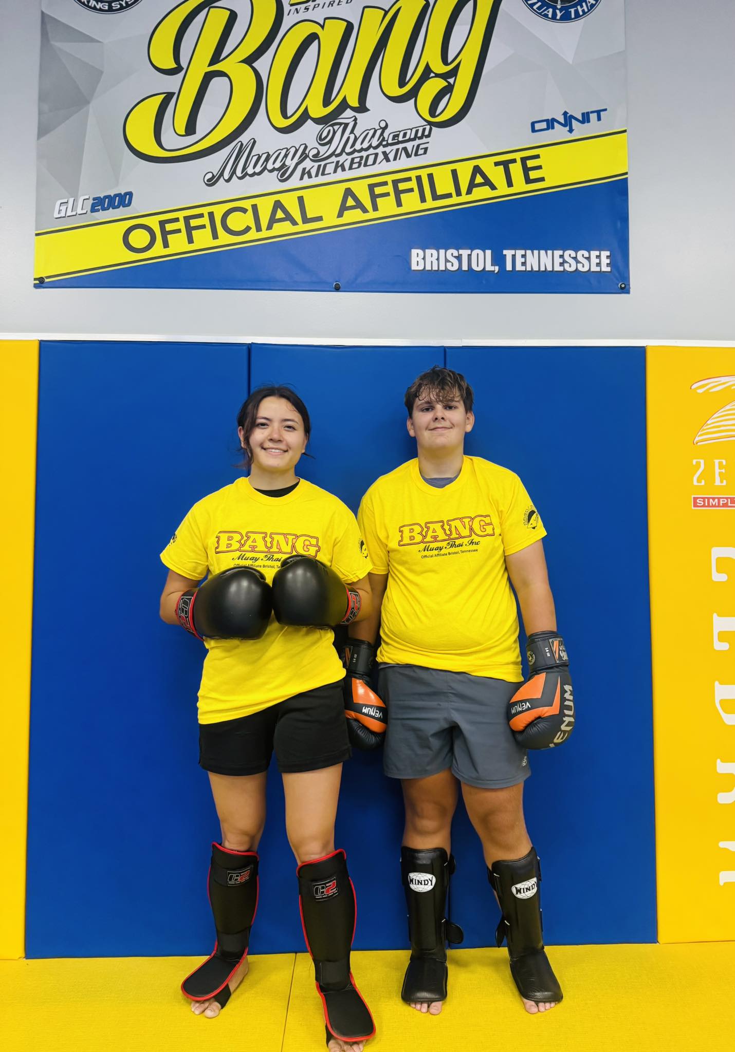 Young martial artists practicing BJJ at Absolute Jiu-Jitsu Academy.