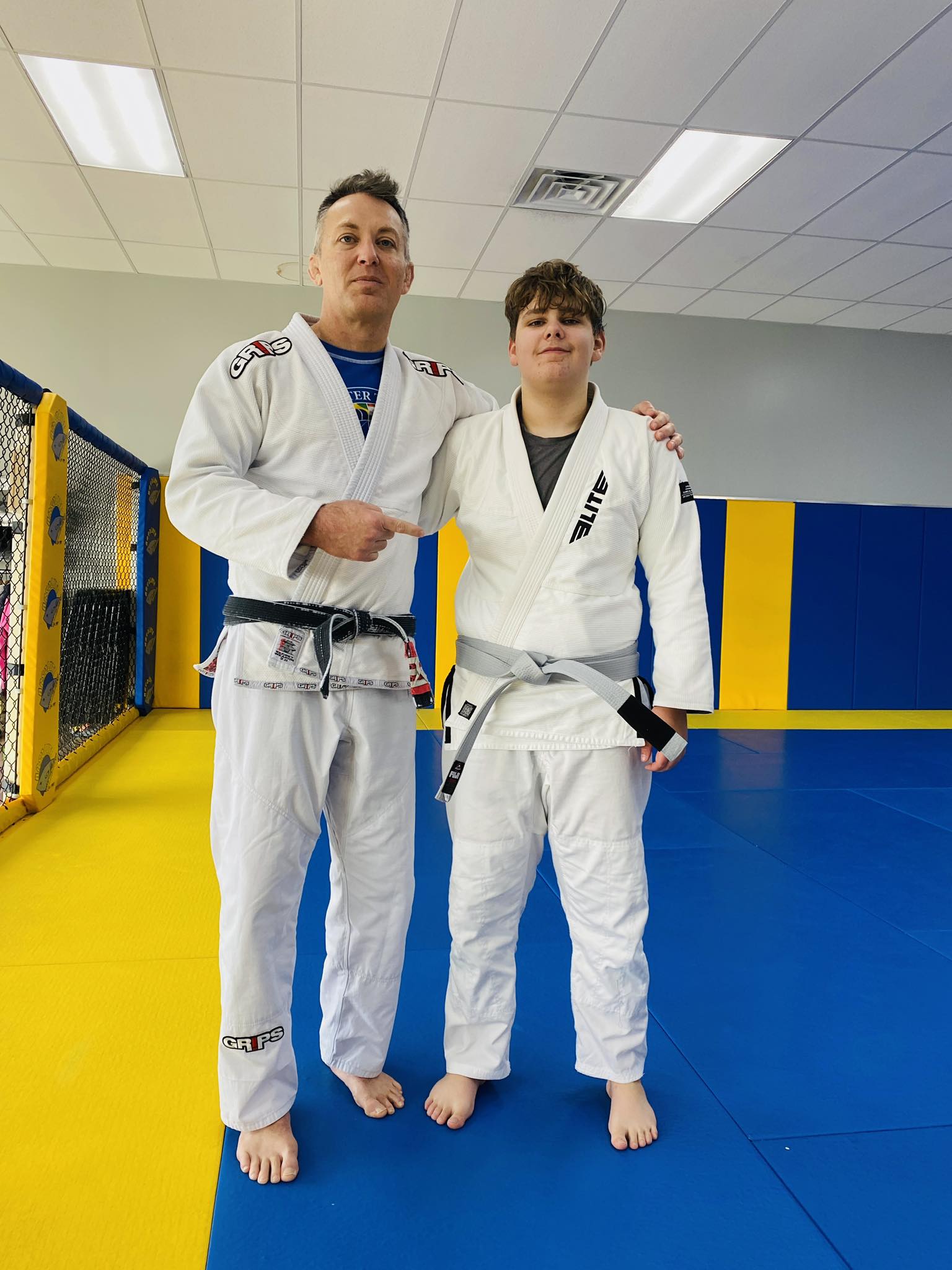 Brazilian Jiu-Jitsu athlete and instructor in BJJ training at Absolute Jiu-Jitsu Academy, martial arts.